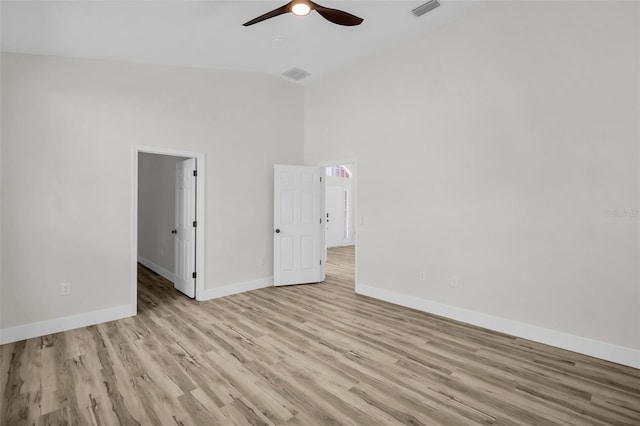 1135 Wyndham Lakes Dr, Odessa, FL 33556 - unfurnished room featuring high vaulted ceiling, ceiling fan, light wood finished floors, baseboards, and visible vents