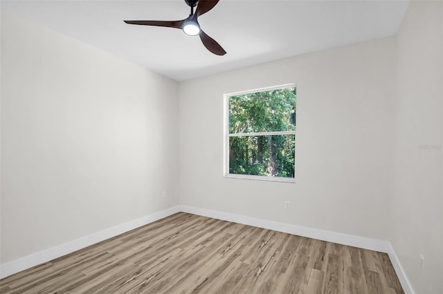 1135 Wyndham Lakes Dr, Odessa, FL 33556 - unfurnished room featuring baseboards, wood finished floors, and ceiling fan
