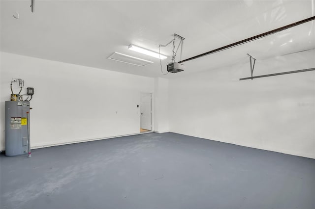 1135 Wyndham Lakes Dr, Odessa, FL 33556 - garage with electric water heater and a garage door opener