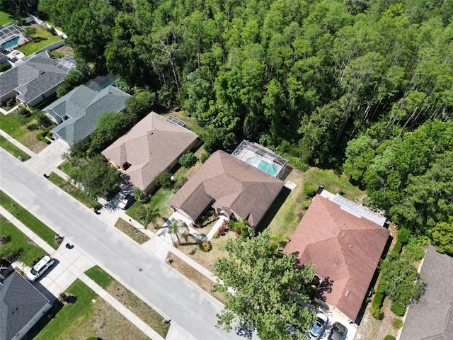 1135 Wyndham Lakes Dr, Odessa, FL 33556 - aerial view featuring a residential view and a wooded view