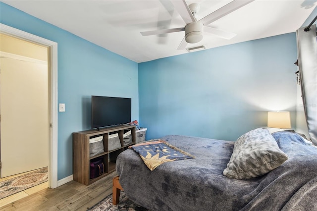 1751 Ashton Abbey Rd, Clearwater, FL 33755 - bedroom with wood finished floors and a ceiling fan