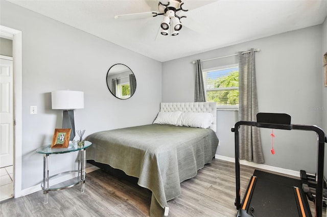 1751 Ashton Abbey Rd, Clearwater, FL 33755 - bedroom featuring wood finished floors and a ceiling fan