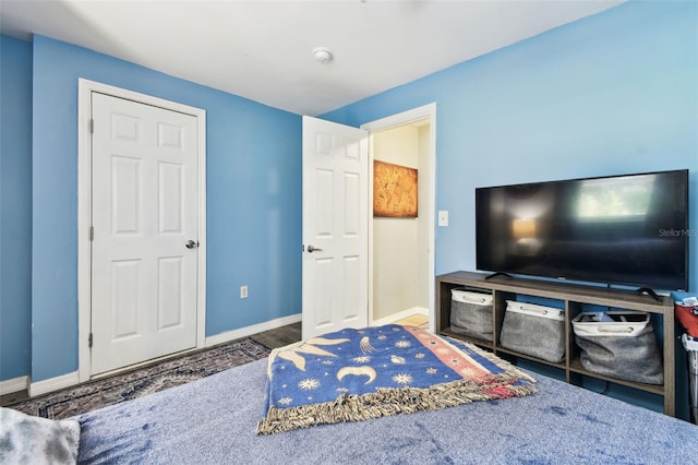 1751 Ashton Abbey Rd, Clearwater, FL 33755 - bedroom with wood finished floors and baseboards