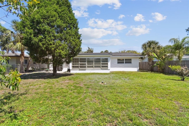 1751 Ashton Abbey Rd, Clearwater, FL 33755 - rear view of house featuring stucco siding and a fenced backyard