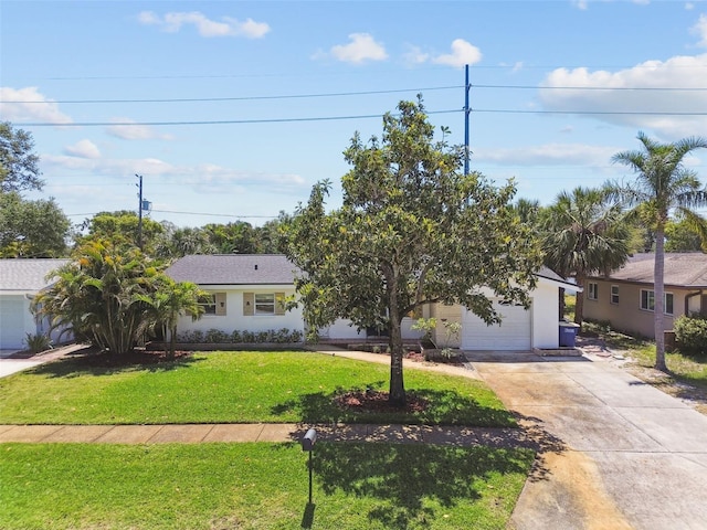 1751 Ashton Abbey Rd, Clearwater, FL 33755 - ranch-style house with concrete driveway, a front lawn, and an attached garage