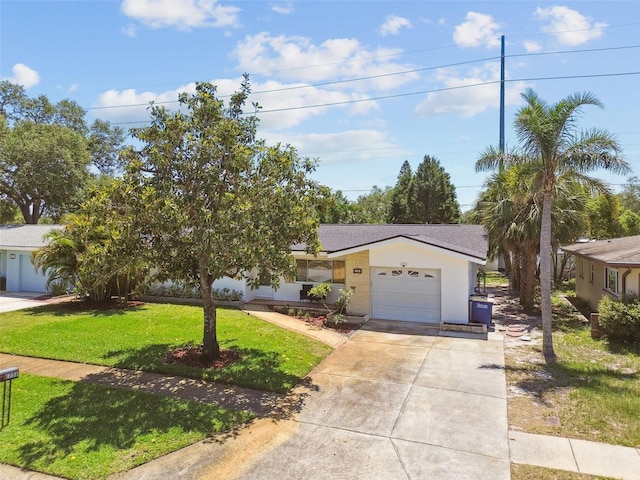 1751 Ashton Abbey Rd, Clearwater, FL 33755 - view of front facade with driveway, an attached garage, a front yard, a shingled roof, and stucco siding