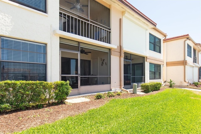6279 Sun Blvd Unit 103, Saint Petersburg, FL 33715 - rear view of house with a lawn and stucco siding