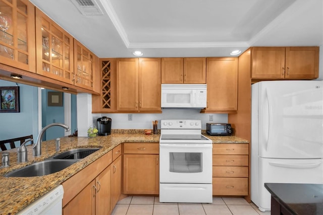 6279 Sun Blvd Unit 103, Saint Petersburg, FL 33715 - kitchen featuring a sink, glass insert cabinets, white appliances, light stone counters, and light tile patterned floors