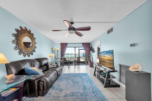 6279 Sun Blvd Unit 103, Saint Petersburg, FL 33715 - living area featuring ceiling fan, a textured ceiling, visible vents, and light tile patterned floors