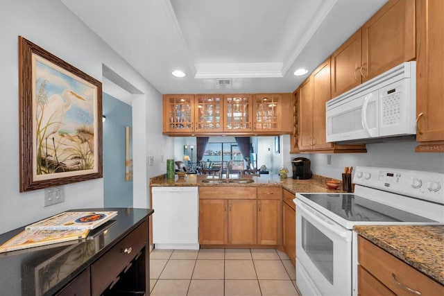 6279 Sun Blvd Unit 103, Saint Petersburg, FL 33715 - kitchen with a sink, light tile patterned flooring, recessed lighting, glass insert cabinets, and white appliances