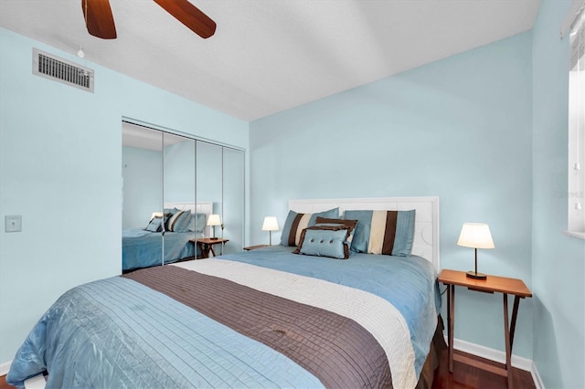 6279 Sun Blvd Unit 103, Saint Petersburg, FL 33715 - bedroom with a closet, visible vents, a ceiling fan, and baseboards