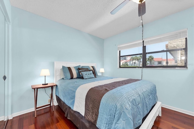 6279 Sun Blvd Unit 103, Saint Petersburg, FL 33715 - bedroom with wood finished floors, a textured ceiling, a ceiling fan, and baseboards