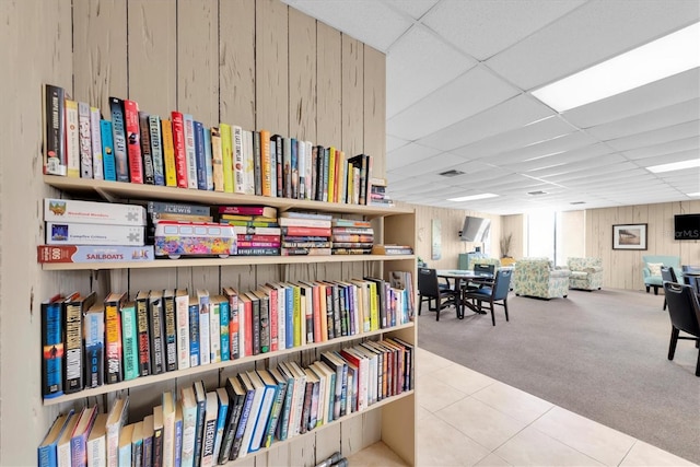 6279 Sun Blvd Unit 103, Saint Petersburg, FL 33715 - interior space with wooden walls, carpet flooring, a drop ceiling, and tile patterned floors