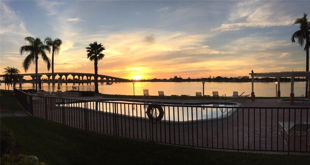 6279 Sun Blvd Unit 103, Saint Petersburg, FL 33715 - exterior space featuring a patio area, a community pool, and a water view