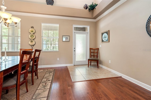 10617 Lucaya Dr, Tampa, FL 33647 - foyer entrance with baseboards, wood finished floors, an inviting chandelier, and crown molding