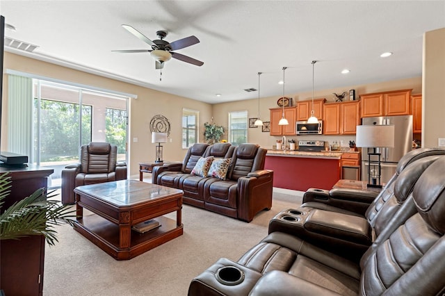 10617 Lucaya Dr, Tampa, FL 33647 - living room featuring ceiling fan, light carpet, visible vents, and recessed lighting