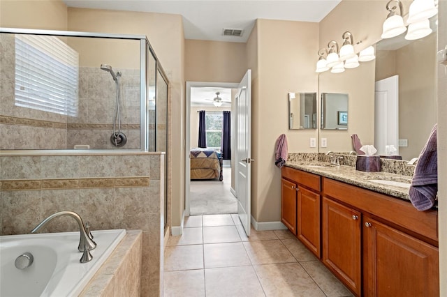 10617 Lucaya Dr, Tampa, FL 33647 - full bathroom featuring a sink, a bath, double vanity, visible vents, and tiled shower