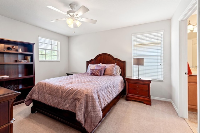 10617 Lucaya Dr, Tampa, FL 33647 - bedroom with ceiling fan, ensuite bathroom, baseboards, and light colored carpet