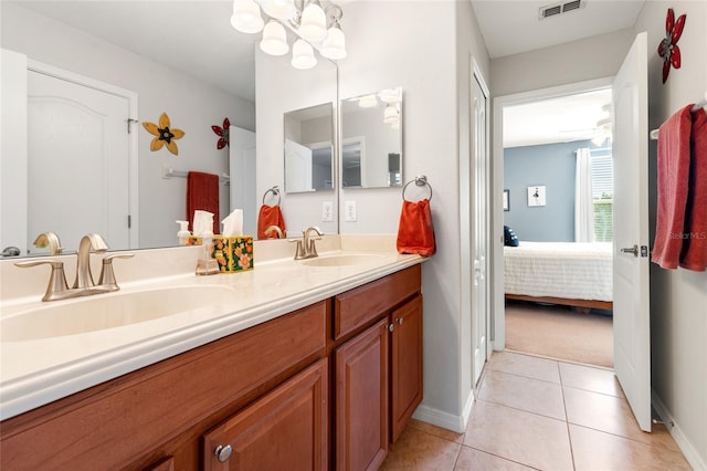 10617 Lucaya Dr, Tampa, FL 33647 - ensuite bathroom featuring tile patterned floors, visible vents, a sink, ensuite bath, and baseboards