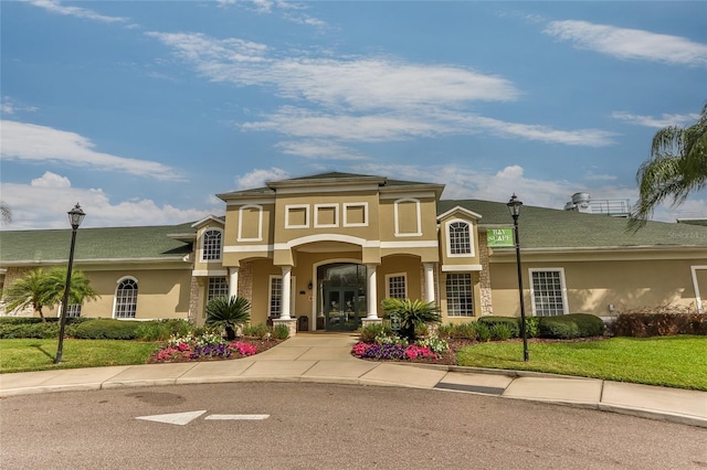 10617 Lucaya Dr, Tampa, FL 33647 - mediterranean / spanish house featuring french doors, a front yard, and stucco siding