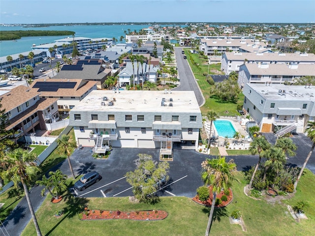 12485 2nd St E Unit C103, Treasure Island, FL 33706 - aerial view of a pool area and a nearby body of water