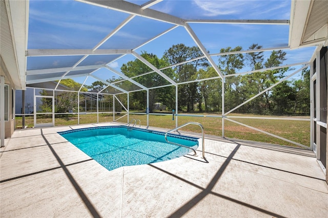 pool with a lanai, a yard, and a patio