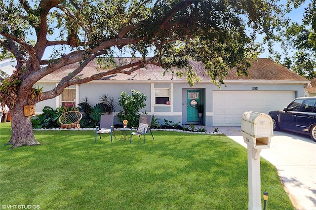 view of front facade featuring an attached garage, concrete driveway, stucco siding, and a front lawn