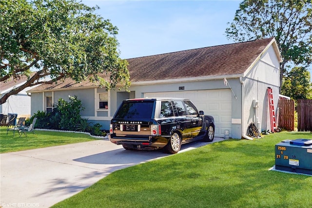 ranch-style home with concrete driveway, stucco siding, roof with shingles, and a front yard