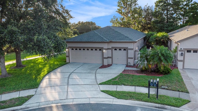 7519 Berna Ln, Land O Lakes, FL 34637 - view of front of home with concrete driveway, a front lawn, a garage, and stucco siding