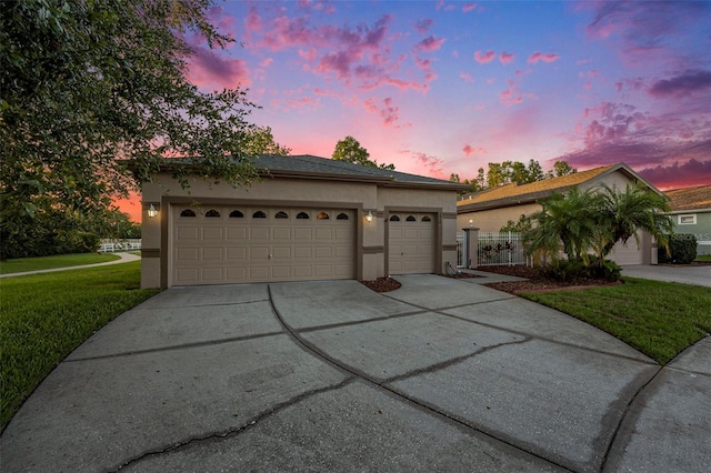 7519 Berna Ln, Land O Lakes, FL 34637 - ranch-style house featuring stucco siding, concrete driveway, a yard, and an attached garage