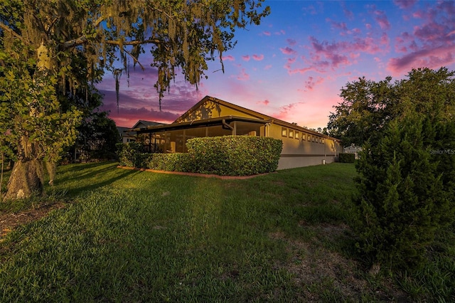 7519 Berna Ln, Land O Lakes, FL 34637 - view of side of home featuring a yard and stucco siding