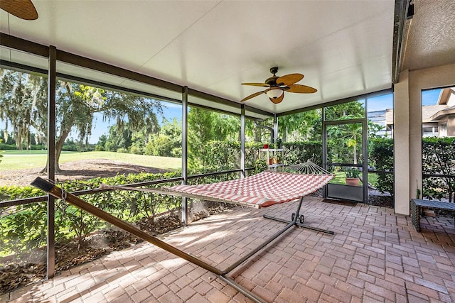 7519 Berna Ln, Land O Lakes, FL 34637 - unfurnished sunroom with ceiling fan