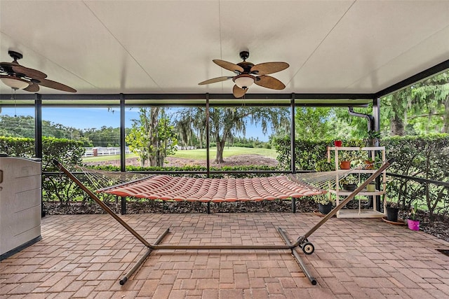 7519 Berna Ln, Land O Lakes, FL 34637 - unfurnished sunroom with ceiling fan