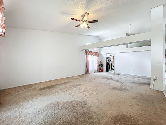 11216 Longbrooke Dr, Riverview, FL 33579 - unfurnished room with vaulted ceiling, carpet flooring, a ceiling fan, and a textured ceiling