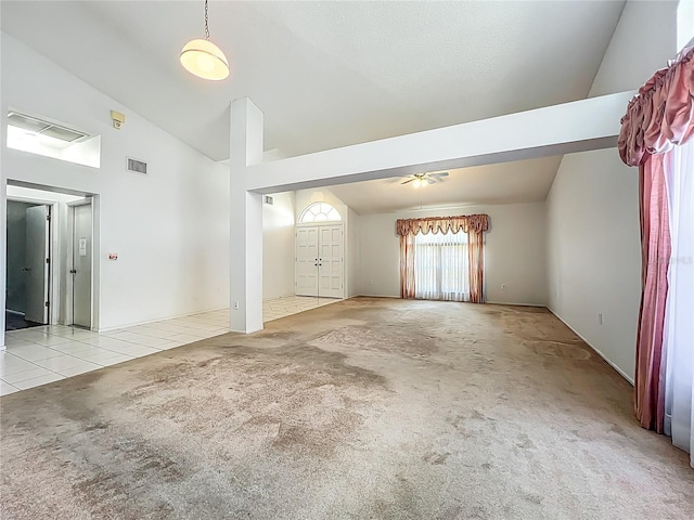 11216 Longbrooke Dr, Riverview, FL 33579 - unfurnished living room featuring carpet, high vaulted ceiling, ceiling fan, and tile patterned flooring