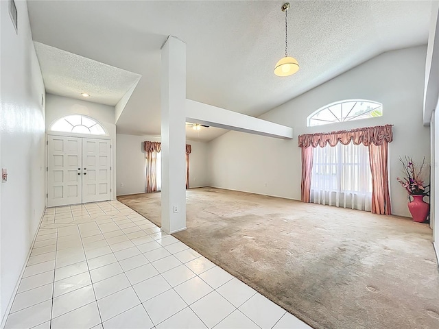 11216 Longbrooke Dr, Riverview, FL 33579 - entrance foyer featuring carpet floors, a textured ceiling, tile patterned flooring, high vaulted ceiling, and ceiling fan