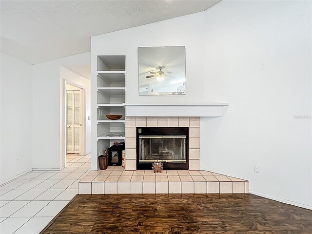 11216 Longbrooke Dr, Riverview, FL 33579 - detailed view of built in features, a ceiling fan, a fireplace, baseboards, and wood finished floors