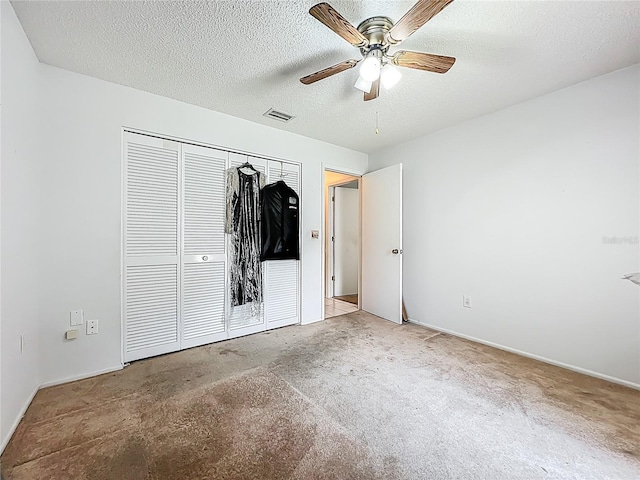 11216 Longbrooke Dr, Riverview, FL 33579 - unfurnished bedroom featuring a textured ceiling, a closet, baseboards, and a ceiling fan