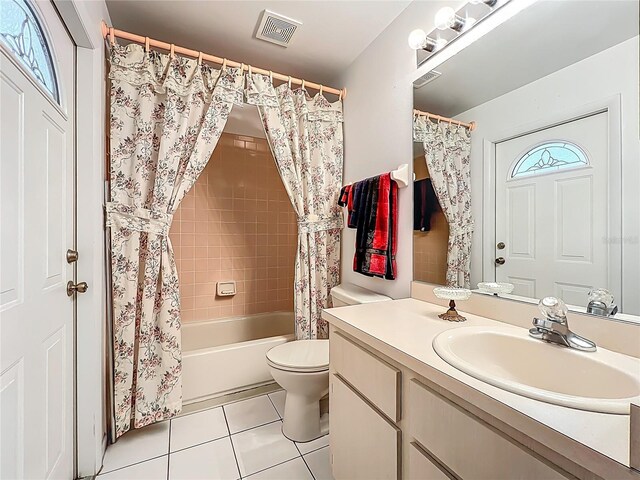 11216 Longbrooke Dr, Riverview, FL 33579 - full bathroom featuring tile patterned flooring, toilet, vanity, and shower / bath combo with shower curtain