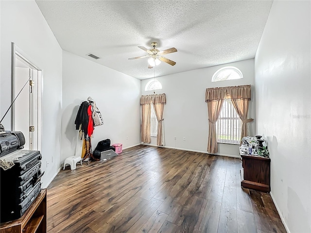 11216 Longbrooke Dr, Riverview, FL 33579 - empty room featuring a ceiling fan, hardwood / wood-style flooring, a textured ceiling, and baseboards