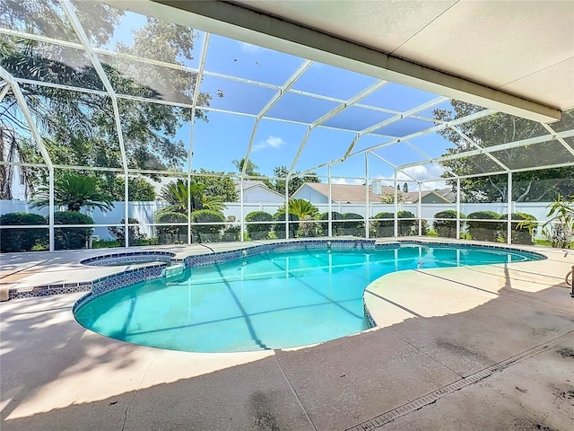 11216 Longbrooke Dr, Riverview, FL 33579 - view of swimming pool with a fenced backyard, a patio, glass enclosure, and a pool with connected hot tub