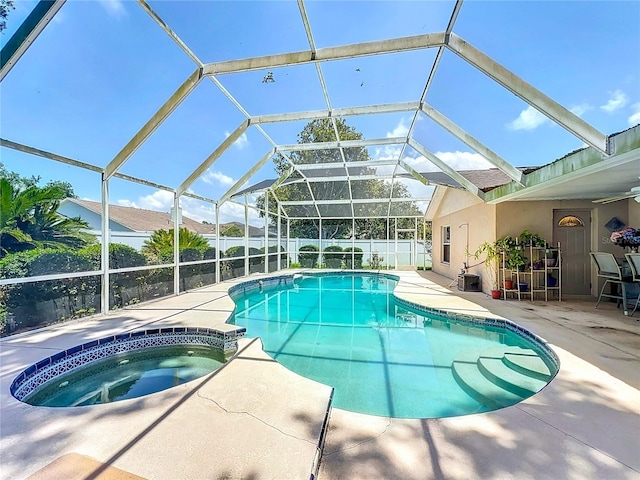 11216 Longbrooke Dr, Riverview, FL 33579 - view of swimming pool featuring a patio, a fenced backyard, a pool with connected hot tub, and glass enclosure