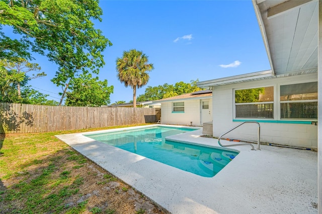view of swimming pool featuring a fenced in pool, a patio, and a fenced backyard