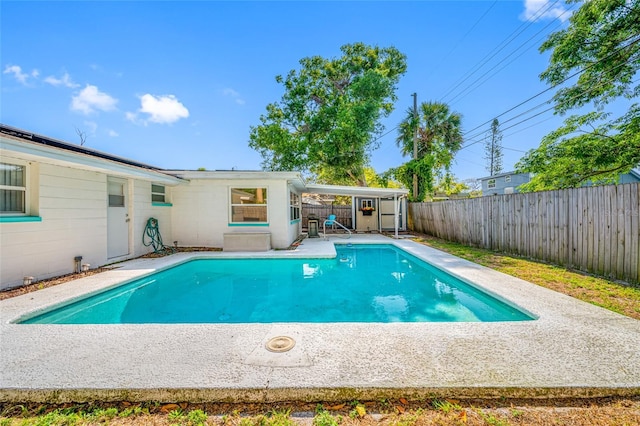 view of swimming pool with a fenced in pool, a patio area, and a fenced backyard