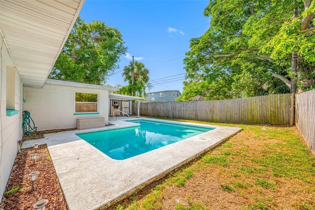 view of swimming pool featuring a fenced in pool, a patio, and a fenced backyard