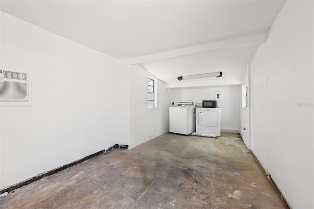 2450 3rd Ave N, Saint Petersburg, FL 33713 - unfurnished room with separate washer and dryer, unfinished concrete flooring, and a wall mounted air conditioner