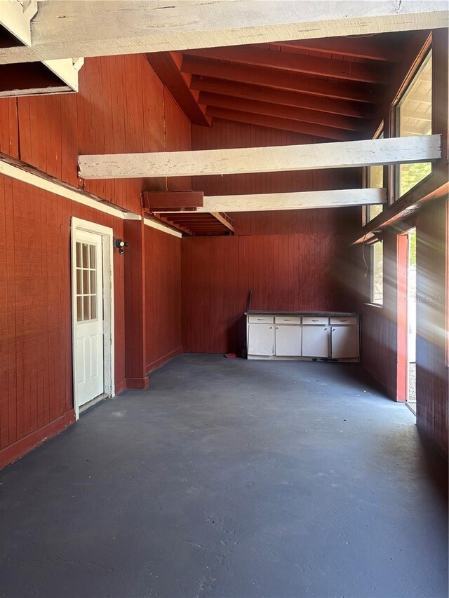 garage featuring wood walls