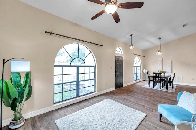 foyer featuring baseboards, wood finished floors, visible vents, and ceiling fan