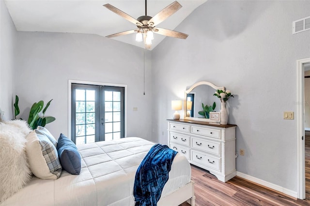 bedroom with french doors, vaulted ceiling, visible vents, baseboards, and wood finished floors