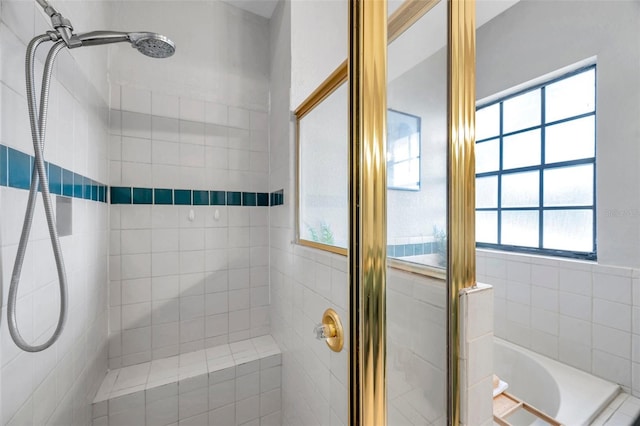 full bathroom with a garden tub and a shower stall